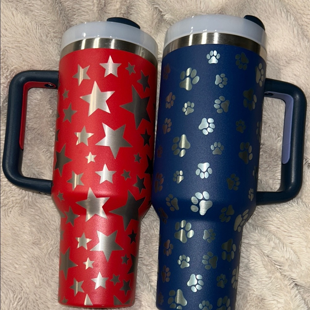 Red and Blue Travel Mugs with Silver Patterns